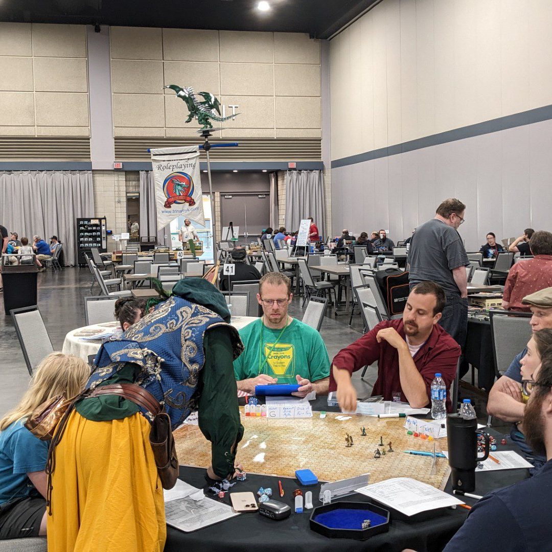People gathered around a table playing a board game.